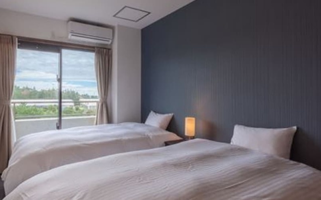 Hotel Condominium Doka Doka – Guest Rooms – Onna