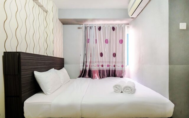Monochrome Style 2 Bedrooms at Kalibata City Apartment By Travelio