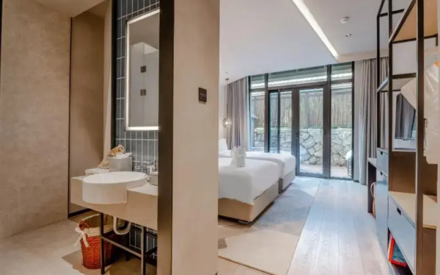 Blossom Hill Hotel Qingdao Aduohuayu