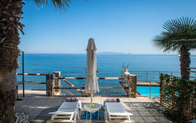Exclusive Seaside Retreat with Shared Pool & Private Beach Access
