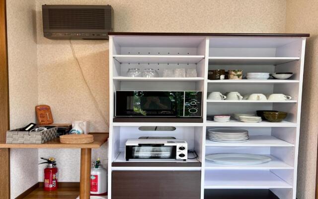 Yellow House by Lake Toya