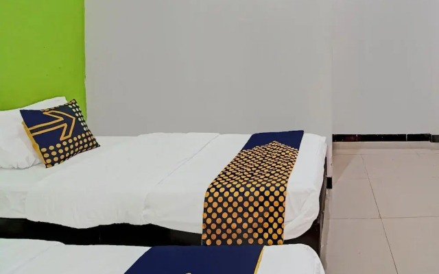SPOT ON 92255 Lucky Guesthouse
