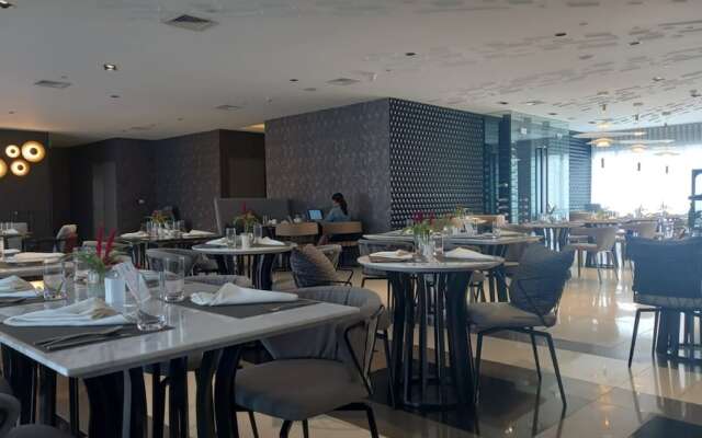 Capital O 950 Acqua Novotel Tower