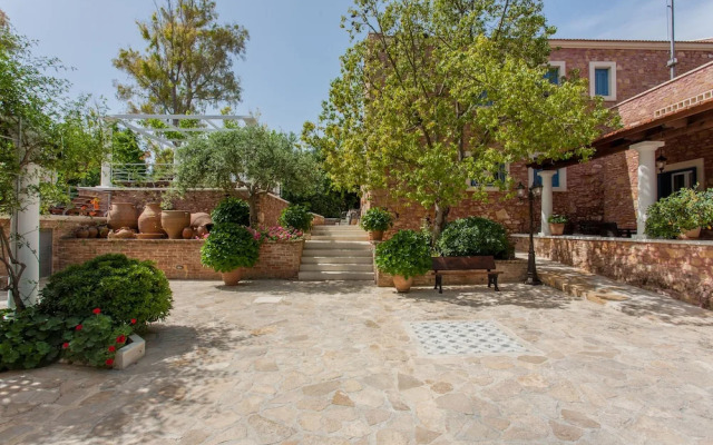 Dine on the Generous Veranda at a Rustic Stone Getaway