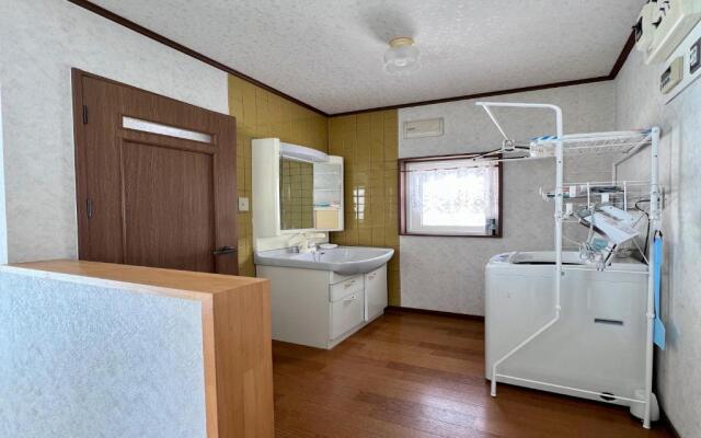 Yellow House by Lake Toya