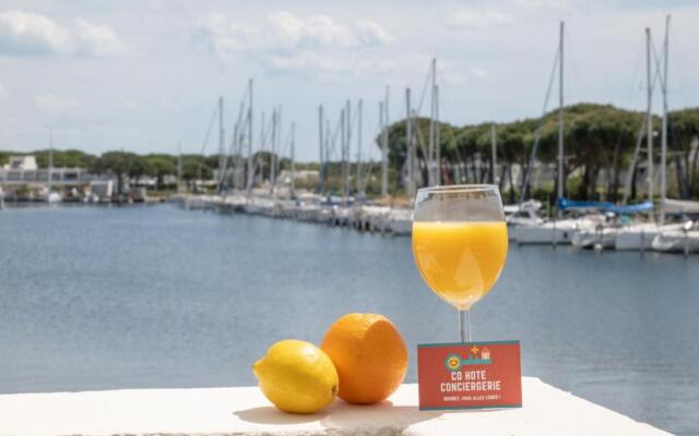 MARINA VUE MER - WIFI- PARKING - PIEDS DANS L'EAU - CoHôteConciergerie Le Grau du Roi La Grande Motte