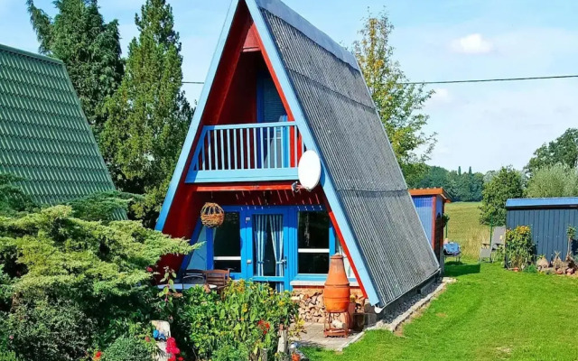 Roof House Near Dummer See With Rowing Boat