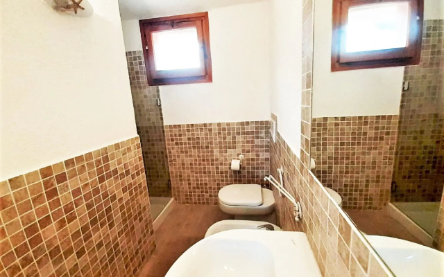 Charming Holiday Home in Marinella With Shared Garden