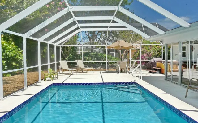 Cozy Home With Sunroom, Pool and Steps to Beach