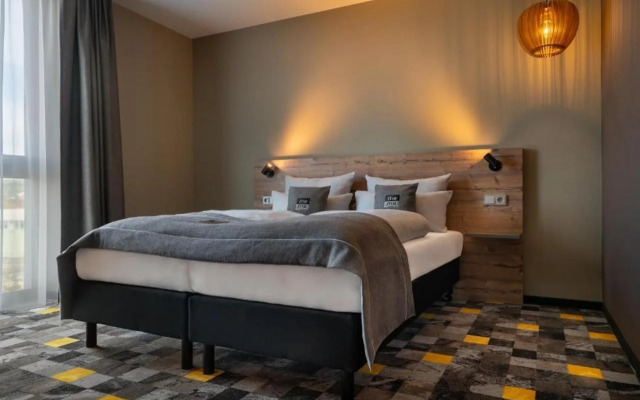 Отель Holiday Inn - the niu, Timber Esslingen, an IHG Hotel