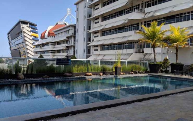 Classic and Modern Studio Apartment at The Square Surabaya By Travelio – Pool – Surabaya