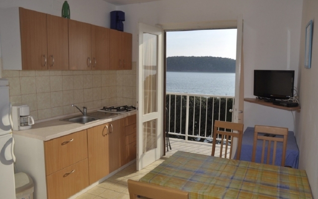 Apartment Petar - 6m from the sea: A1 Barbat, Island Rab