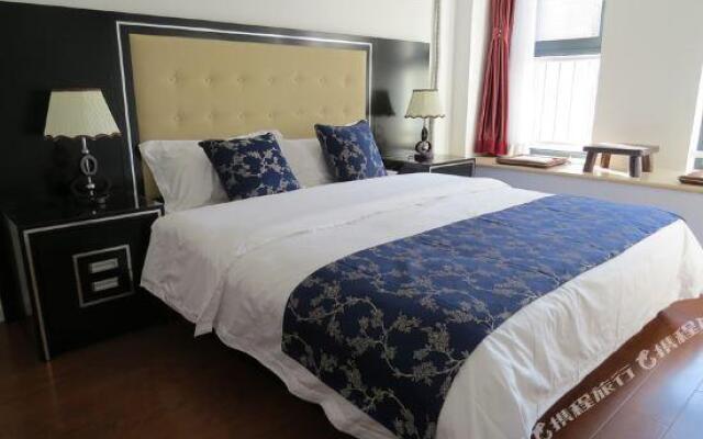 Guan County Hong Pu Traders Hotel
