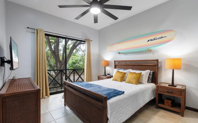 Modern Island-Themed Condo with Floor-to-Ceiling Windows & Garden and Pool Views Within Walking Distance of the Beach