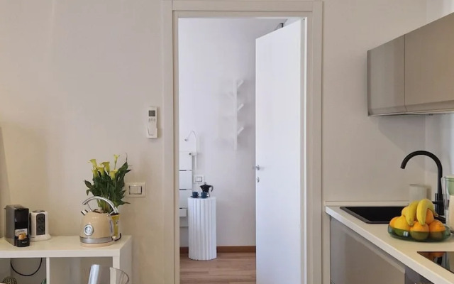 Moderno Bilocale con Terrazzo e Parcheggio