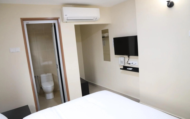 Capital O 90897 Island City Hotel