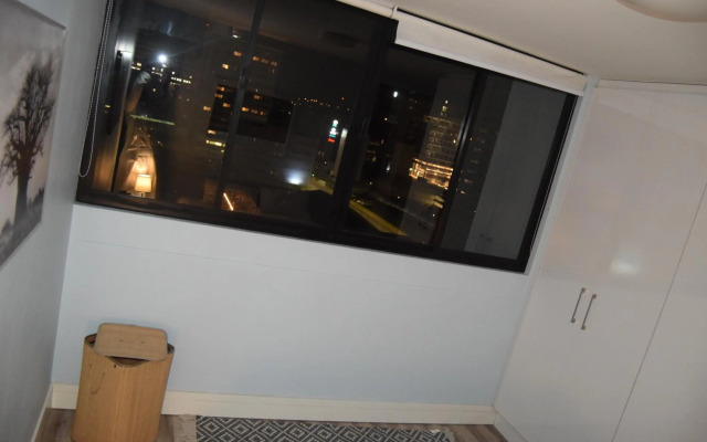 Highrise Windhoek apartment with skyline view, pool and gym