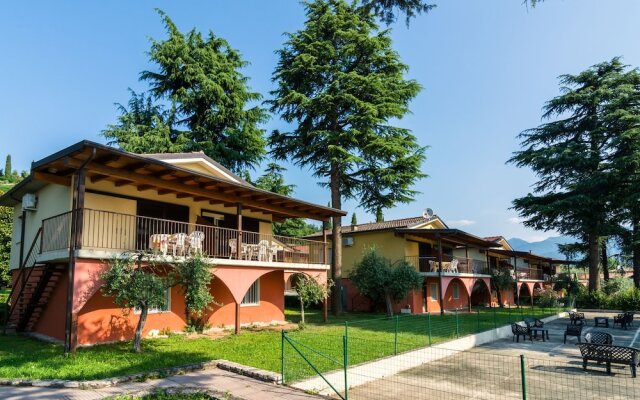 Apartment on Lake Garda With Pebble Beach, Pier for Boat, Three Swimming Pools