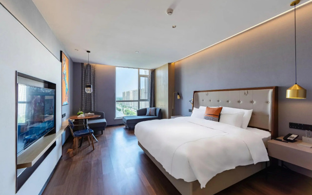Ginza Jiayue Select Hotel (Qihe Wanda Plaza Spring City Oulebao)