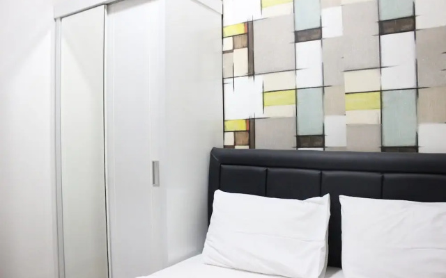 Minimalist 2BR The Suites Metro Apartment By Travelio