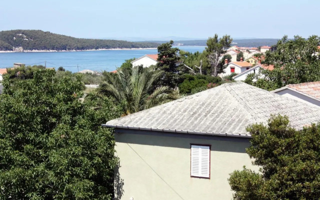 Apartments and rooms with parking space Barbat, Rab - 5070