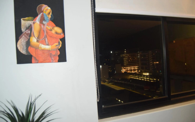 Highrise Windhoek apartment with skyline view, pool and gym