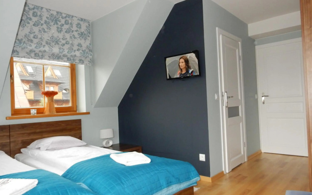 Domek za Strugiem - pokoje i apartamenty