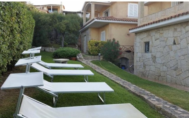 House with 3 bedrooms in Cannigione with wonderful sea view enclosed garden and WiFi 600 m from the beach