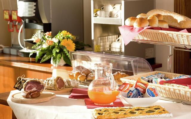 An agritourism complex with views of Assisi.