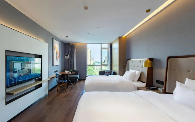 Ginza Jiayue Select Hotel (Qihe Wanda Plaza Spring City Oulebao)