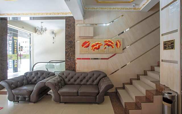 Capital O Hotel Grand Orchard