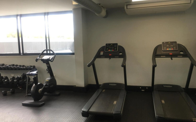 Highrise Windhoek apartment with skyline view, pool and gym