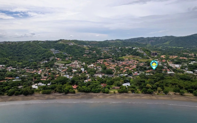 Modern Island-Themed Condo with Floor-to-Ceiling Windows & Garden and Pool Views Within Walking Distance of the Beach