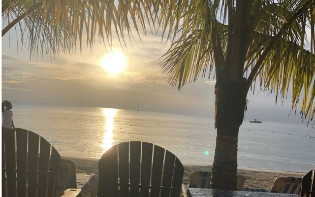 Seacret Studios - Cozy Jamaican Retreat Apts by RedAwning