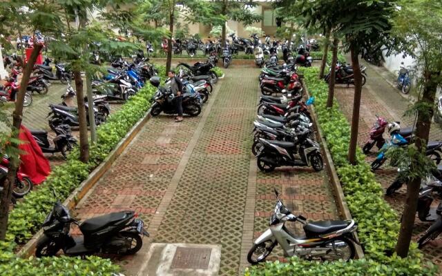 Monochrome Style 2 Bedrooms at Kalibata City Apartment By Travelio