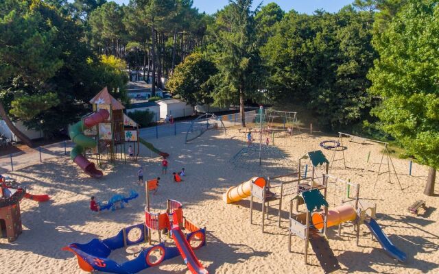 Cozy Mobile Home With Covered Terrace on a Luxury Campsite