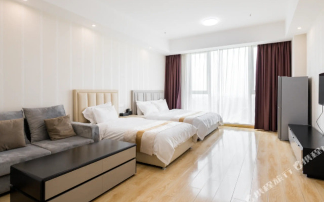 Baiya Light Luxury Holiday Apartment (Yangzhou Railway Station Jinghuacheng Branch)