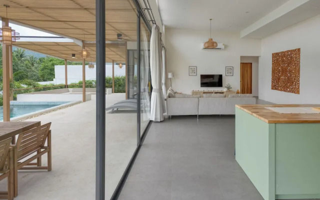 Tropical Poolside Retreat by Sea N' Rent