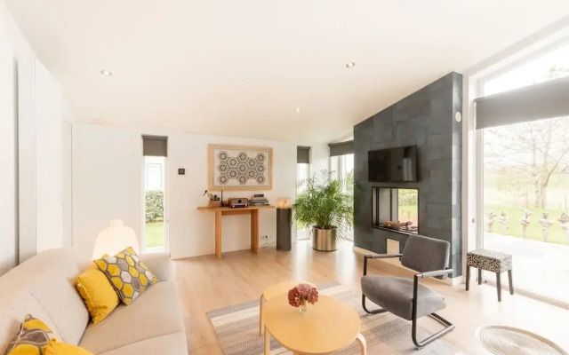 Modern Chalet With a Fireplace