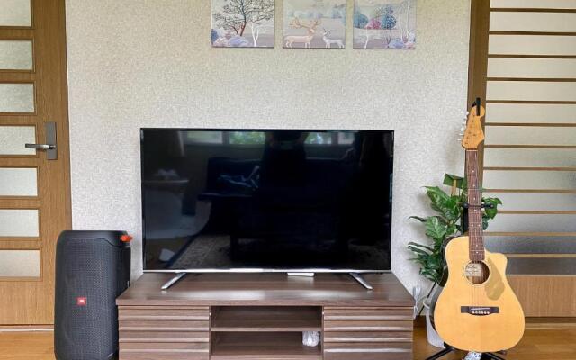 Yellow House by Lake Toya