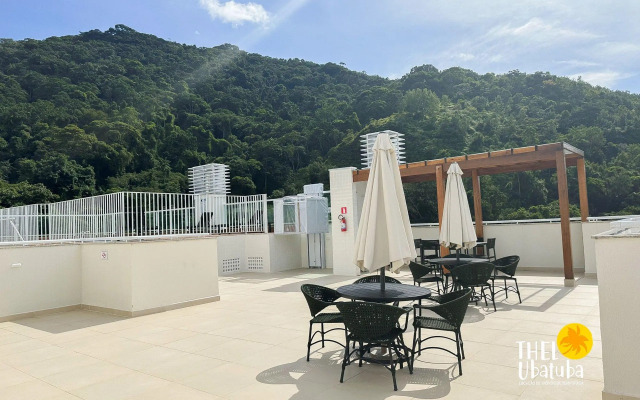 Apto completo e confortável com roupa de cama nas Toninhas  Condomínio Lumière