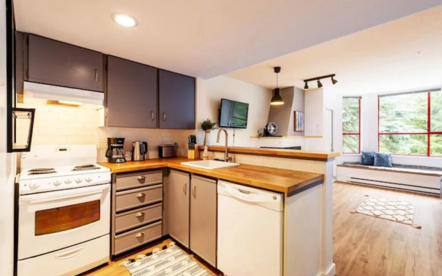 Cozy Creekside Two-Storey Condo