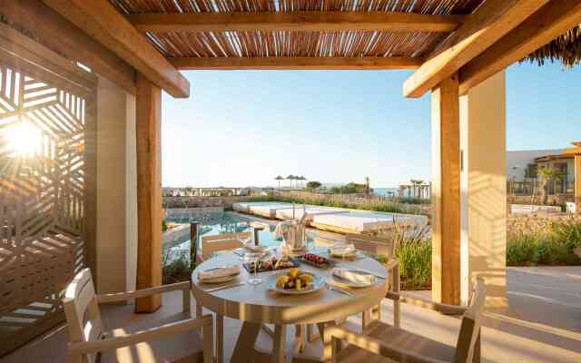 Отель Mitsis Rinela Beach