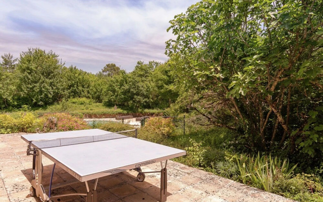 A Romantic Hamlet With Lush Gardens on a Hill