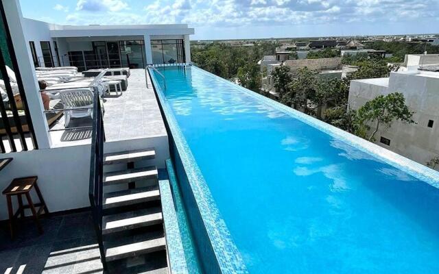 Fresh and Stylish Studio Aldea Zama rooftop pool Mya 109