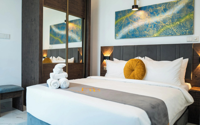 Aina Residency Beachfront Hotel