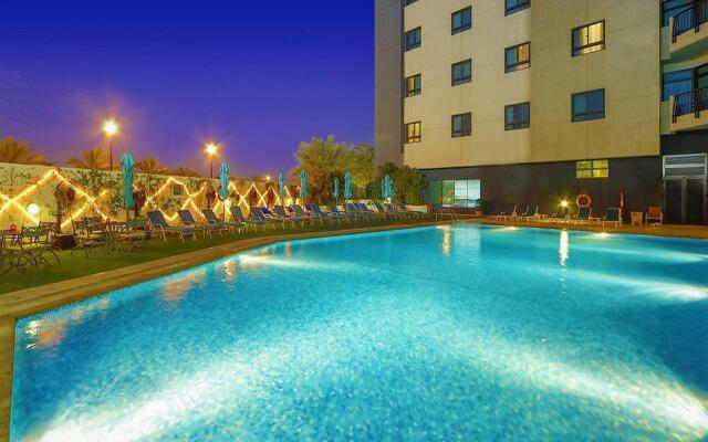 Отель Arabian Park Dubai, an Edge by Rotana Hotel