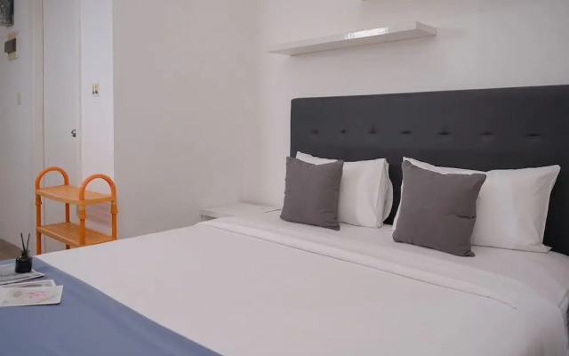Comfortable and Warm Studio at Poris 88 Apartment