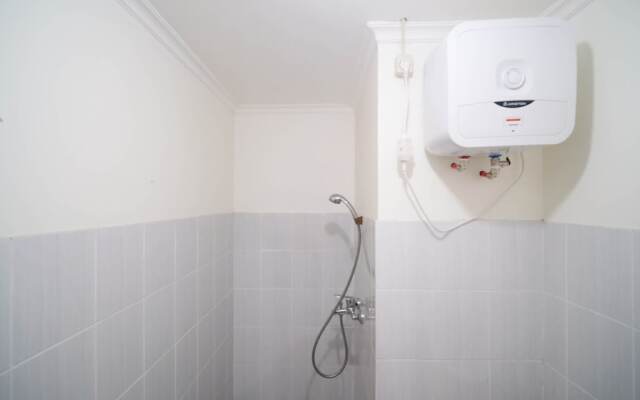 Cozy Living And Tidy 2Br At Puncak Dharmahusada Apartment