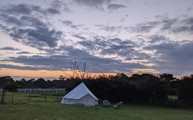 Log cabin retreat and luxury bell tent